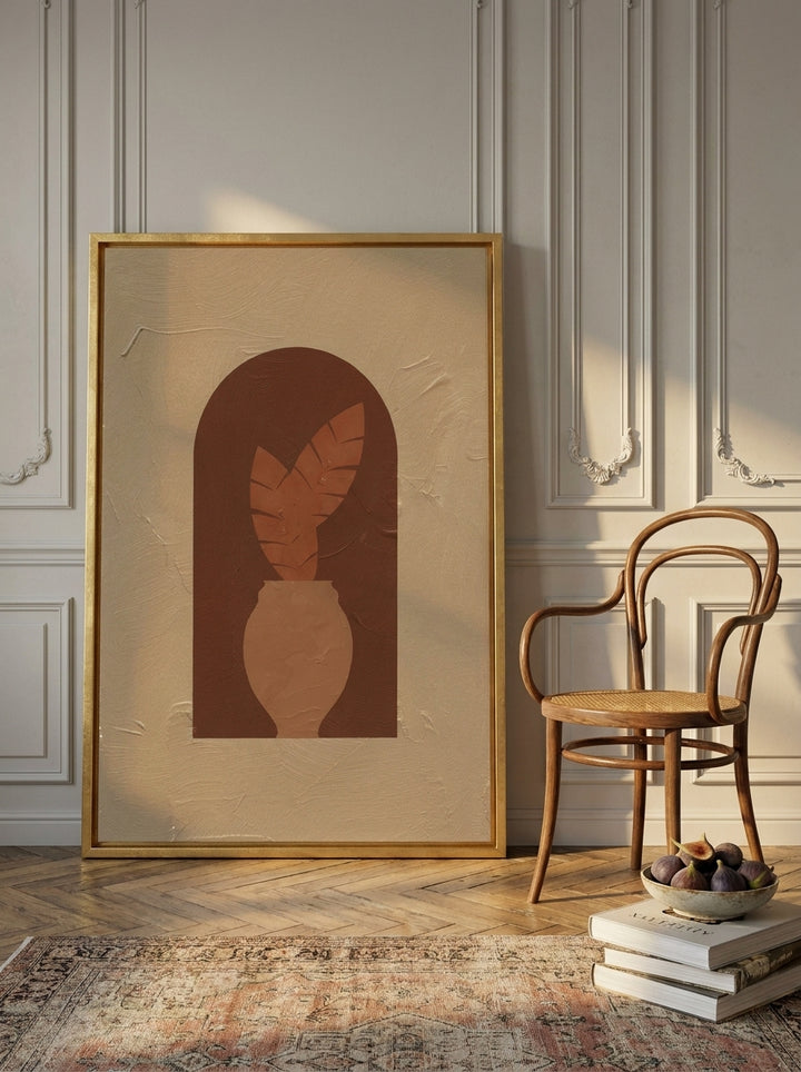 Oversized statement canvas wall art with a gold leaf surround leaning against the wall in a Parisian living room