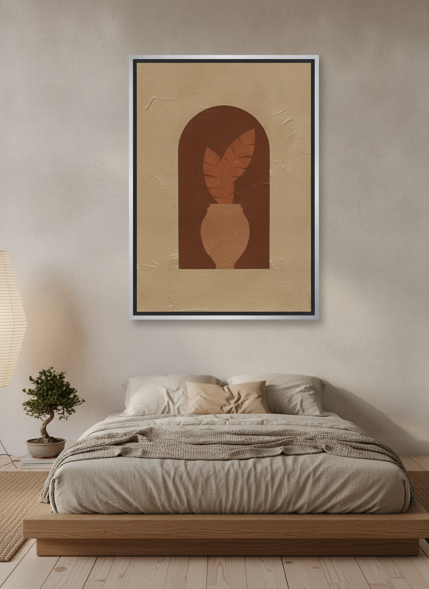 Canvas wall art with a silver leaf surround styled on the wall in a warm Japandi bedroom