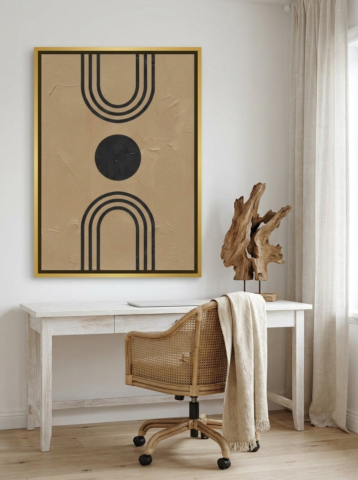Canvas wall art with a gold leaf surround styled on the wall in a coastal home office