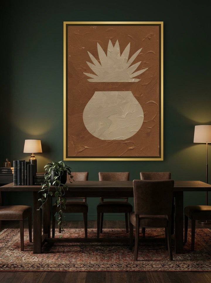 Oversized statement canvas wall art with a gold leaf surround styled on the wall in a moody dining room