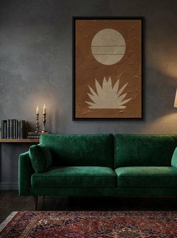 Canvas wall art with a black surround styled on the wall in a moody living room