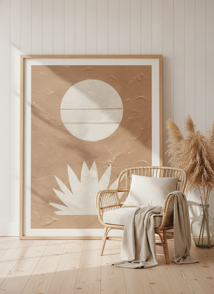 Oversized statement modern wall art print leaning against the wall in a coastal living room