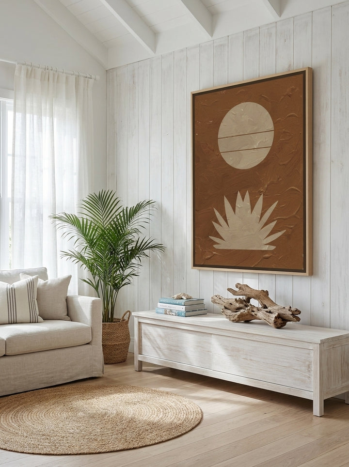 Oversized statement canvas wall art with a natural timber surround styled on the wall in a coastal living room