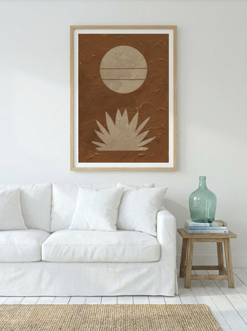 Modern wall art print styled on the wall in a coastal living room