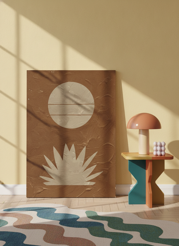 Stretched canvas wall art leaning against the wall in a colourful eclectic home office