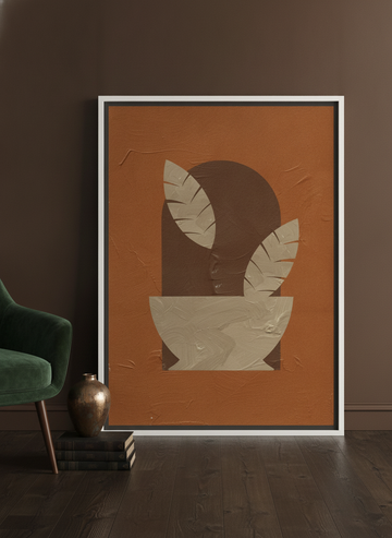 Canvas wall art with a white surround leaning against the wall in a moody kitchen
