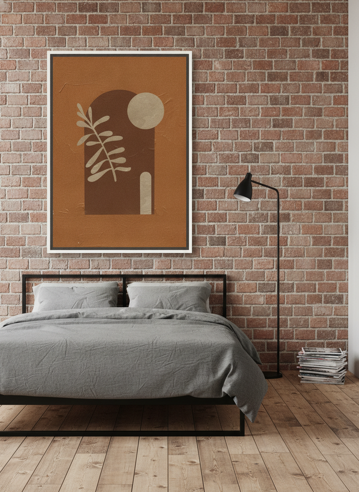 Canvas wall art with a white surround styled on the wall in an industrial loft bedroom