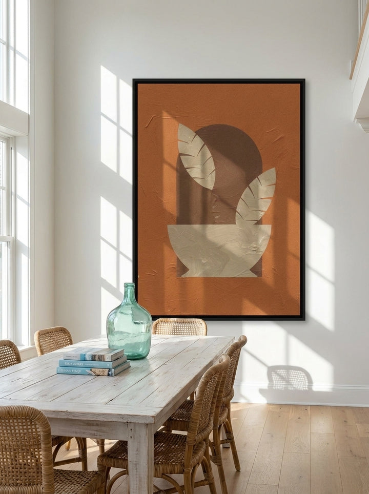 Oversized statement canvas wall art with a black surround styled on the wall in a coastal dining room