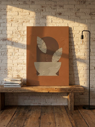 Stretched canvas wall art standing on a bench in an industrial loft bedroom