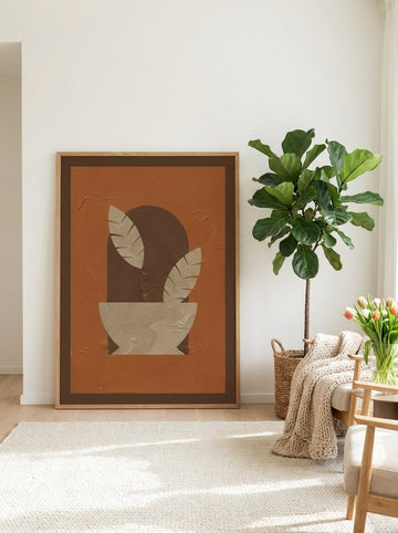 Oversized statement modern wall art print leaning against the wall in a bright Scandinavian dining room