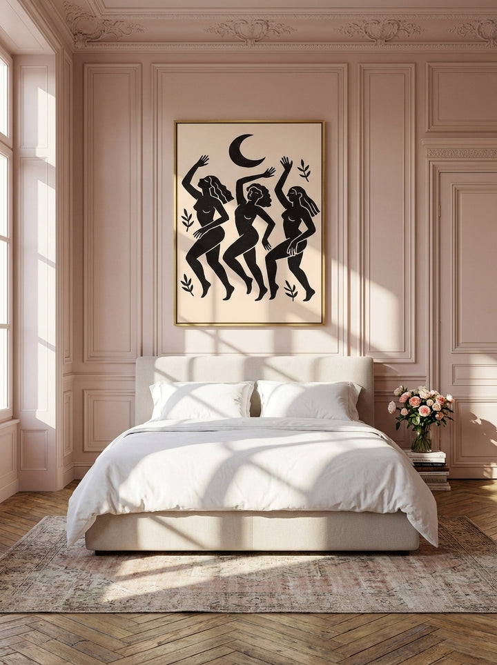 Canvas wall art with a gold leaf surround styled on the wall in a Parisian bedroom