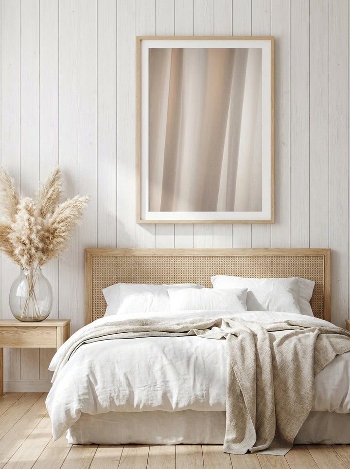 Modern wall art print styled on the wall in a coastal bedroom
