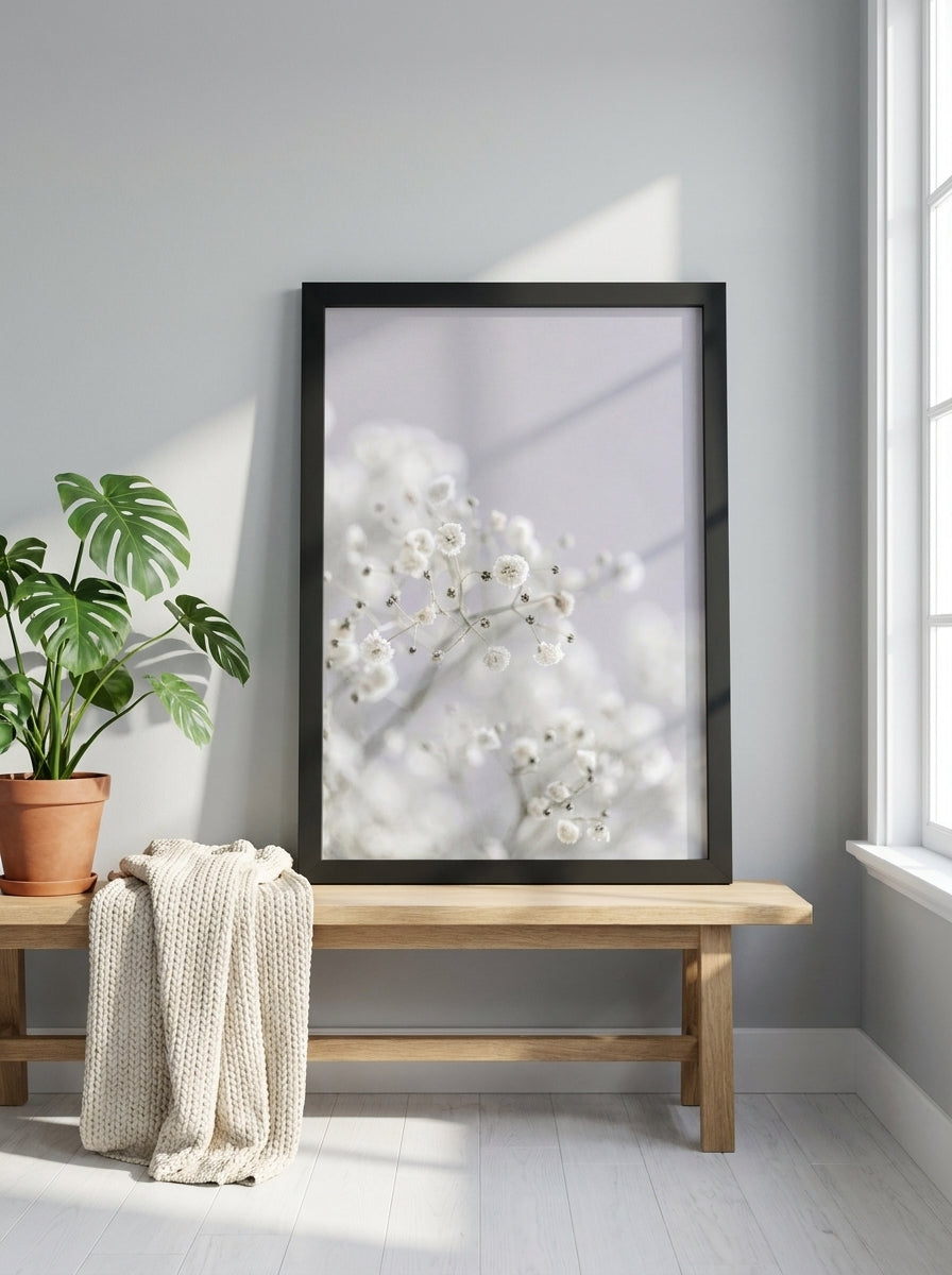 Modern wall art print standing on a bench in a bright Scandinavian bathroom