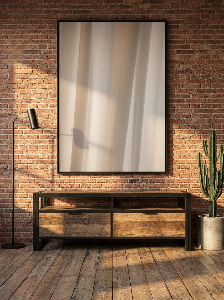 Oversized statement canvas wall art with a white surround styled on the wall in an industrial loft living room