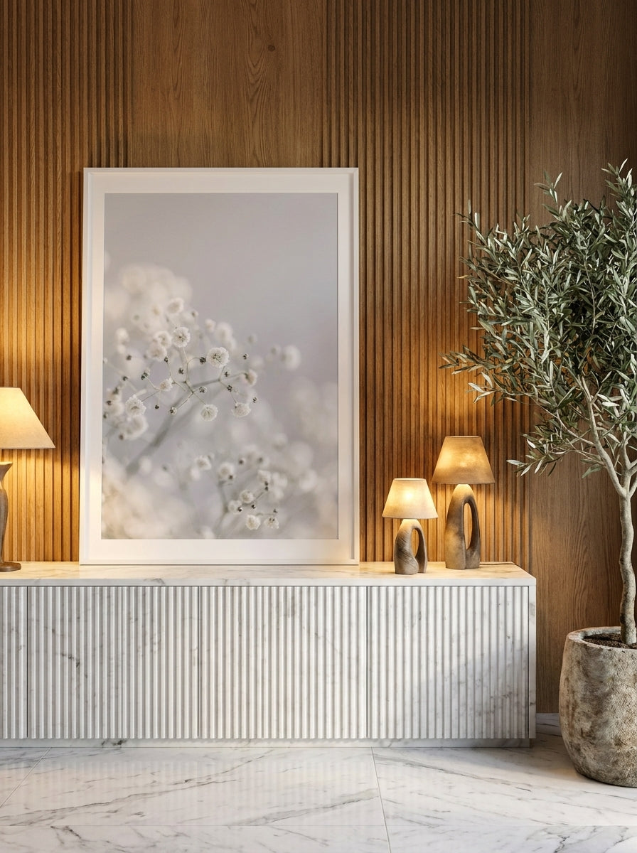 Modern wall art print standing on a sideboard in a luxe bedroom