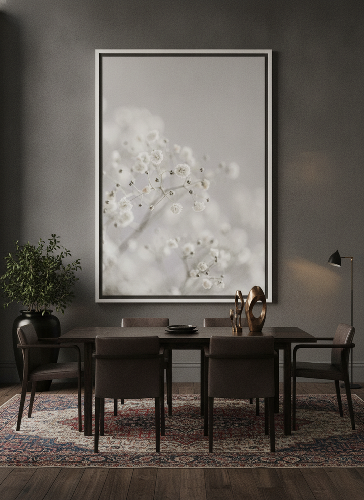 Oversized statement canvas wall art with a white surround styled on the wall in a moody dining room