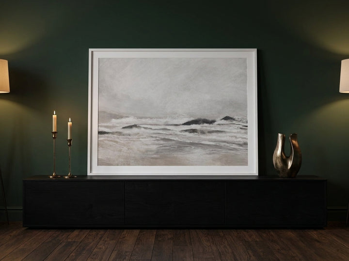 Modern wall art print standing on a console in a moody living room