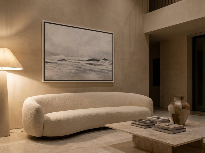 Oversized statement canvas wall art with a white surround styled on the wall in a luxe living room