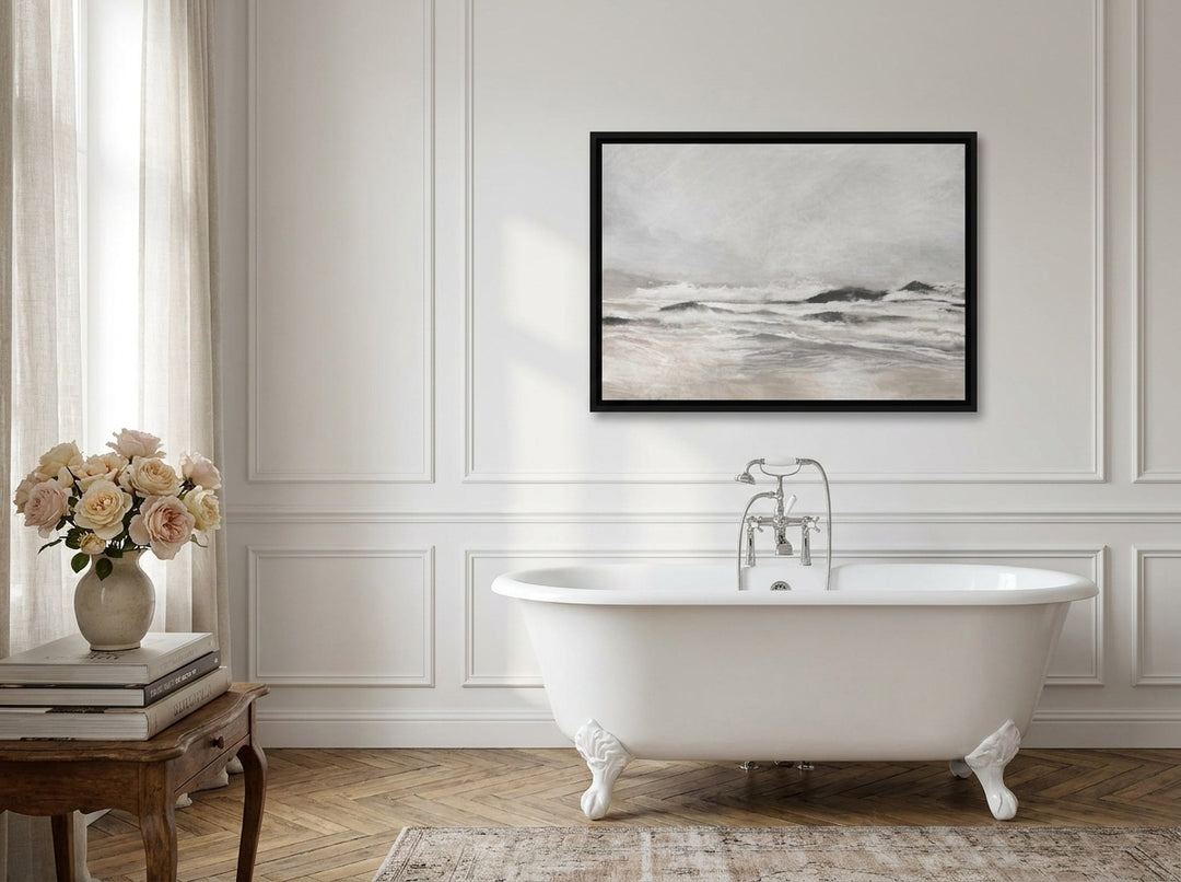 Canvas wall art with a black surround styled on the wall in a Parisian bathroom