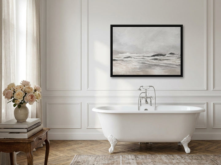 Canvas wall art with a black surround styled on the wall in a Parisian bathroom