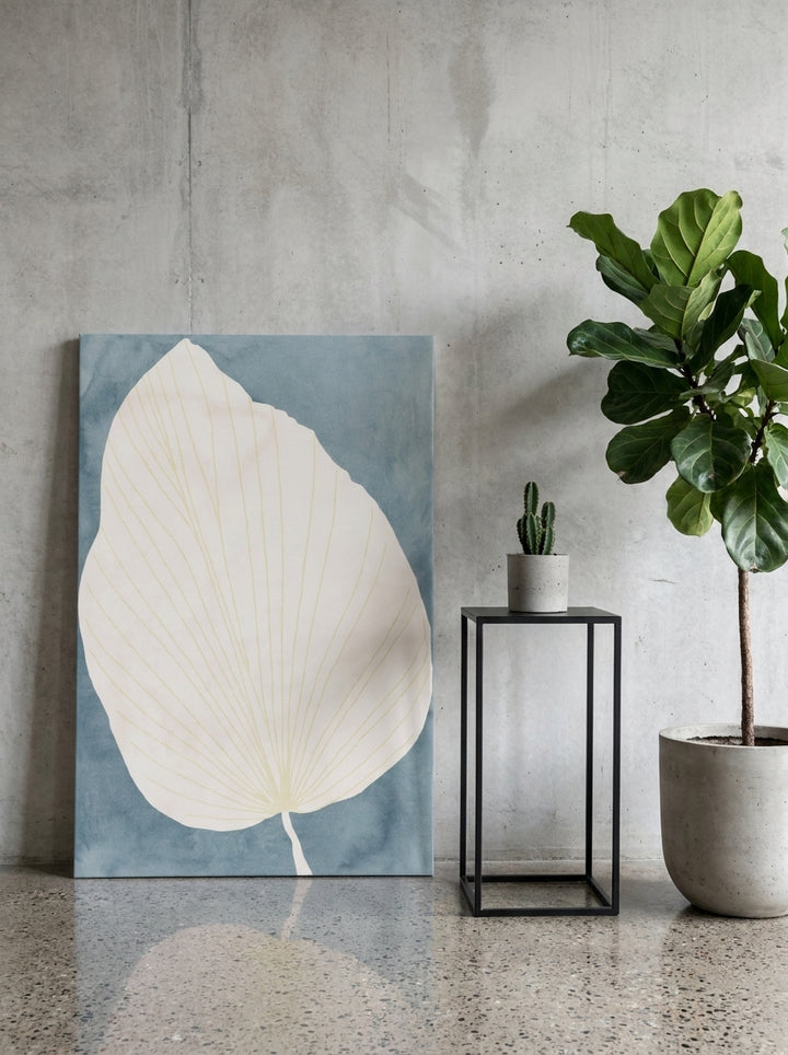 Stretched canvas wall art leaning against the wall in an industrial loft living room