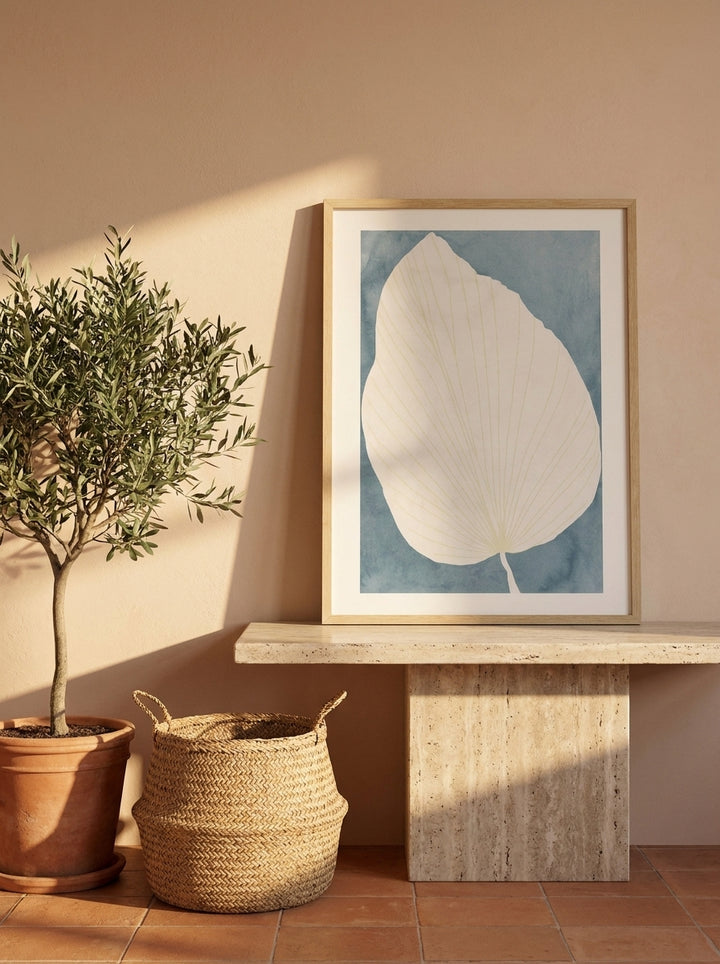 Modern wall art print standing on a console in a Mediterranean home office