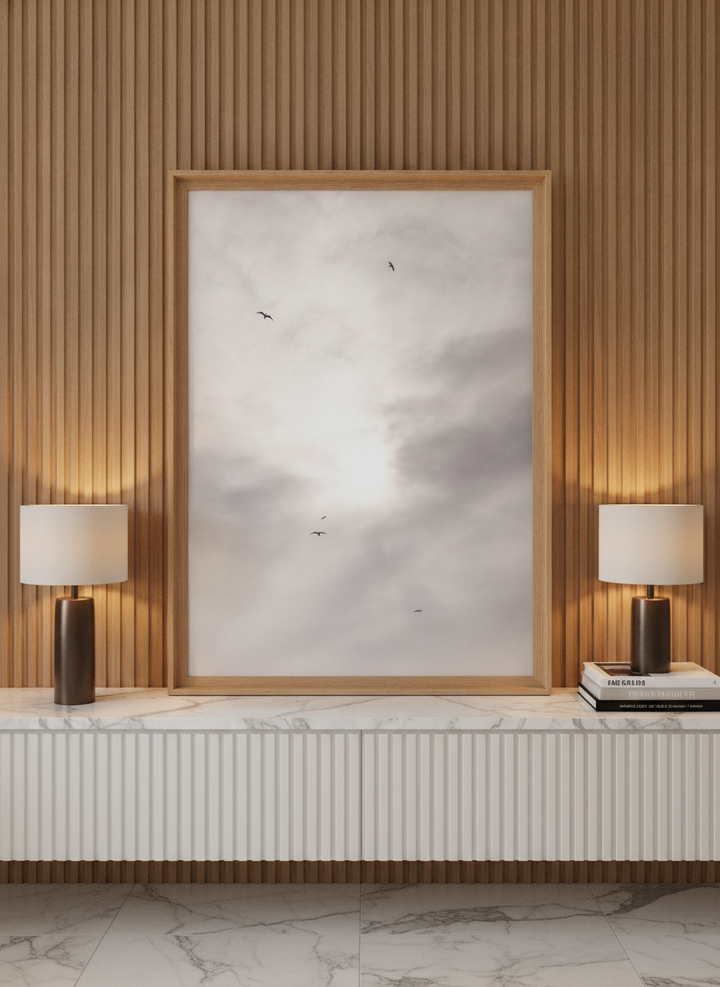 Modern wall art print standing on a sideboard in a luxe bathroom