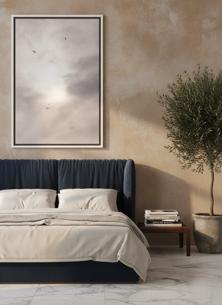 Oversized statement canvas wall art with a white surround styled on the wall in a luxe bedroom