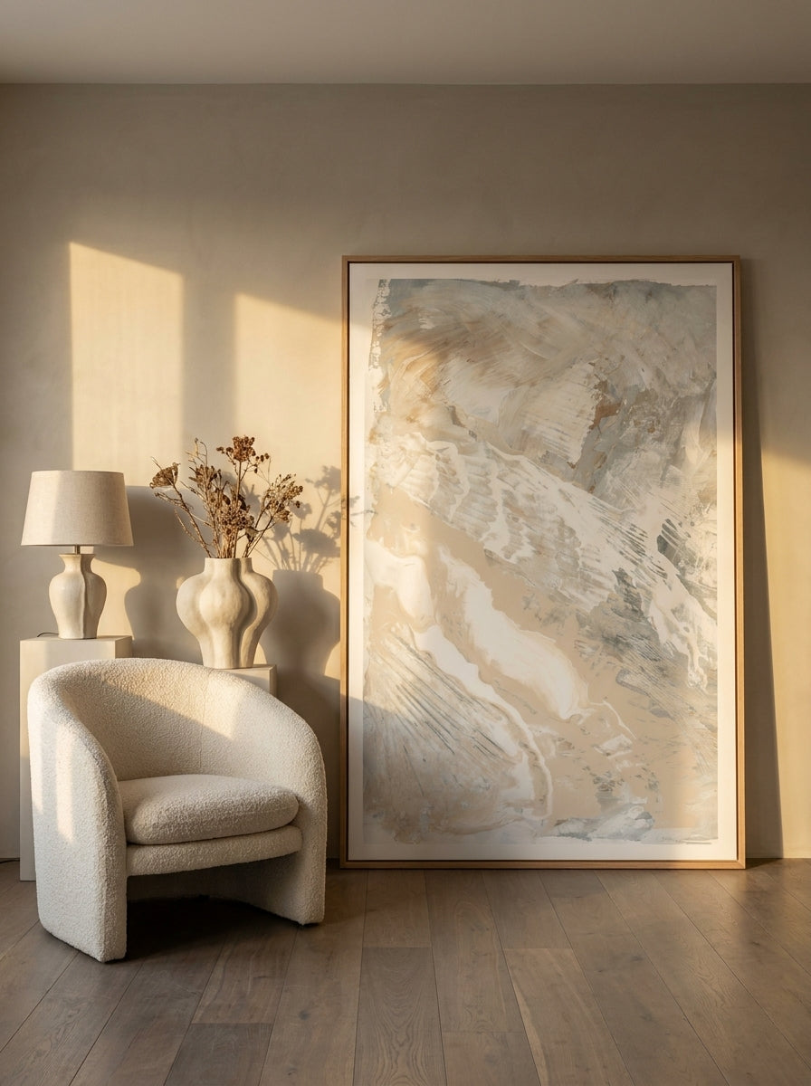 Oversized statement modern wall art print leaning against the wall in a luxe living room