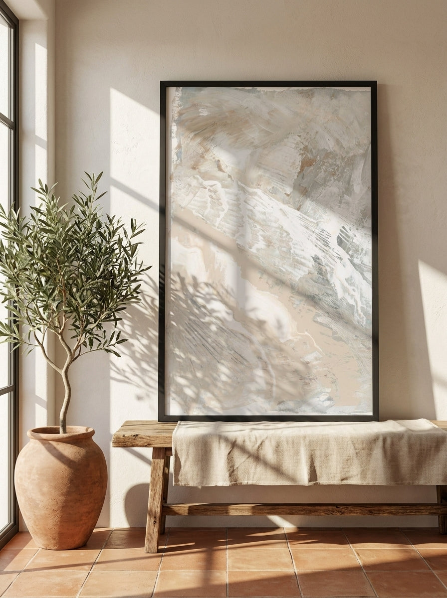 Modern wall art print standing on a bench in a Mediterranean living room