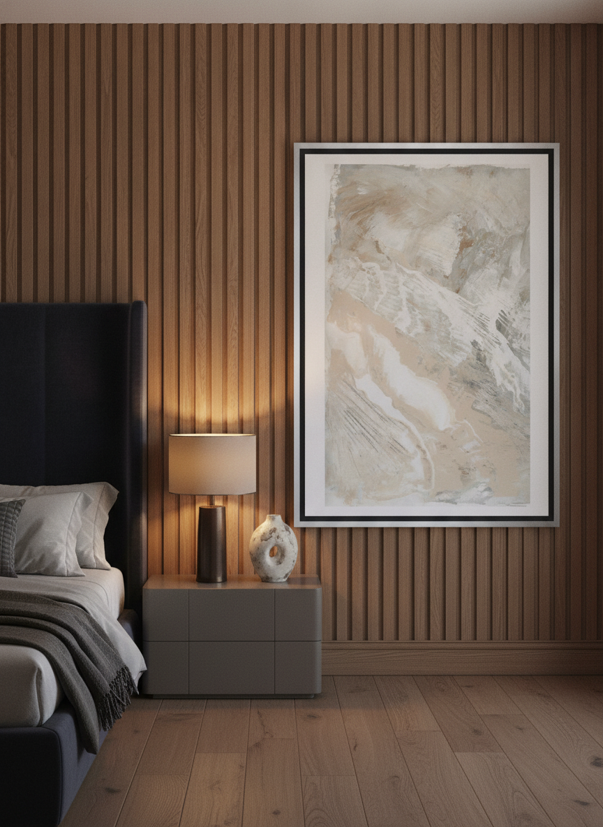 Oversized statement canvas wall art with a silver leaf surround styled on the wall in a luxe bedroom