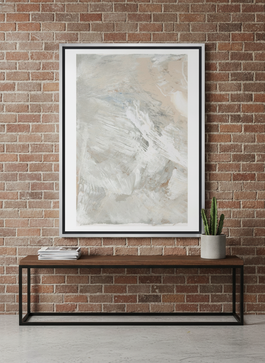 Canvas wall art with a silver leaf surround standing on a console in an industrial loft bedroom