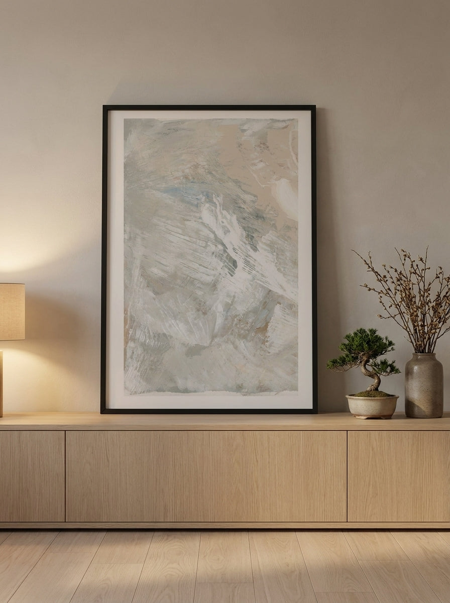 Modern wall art print standing on a sideboard in a warm Japandi bedroom