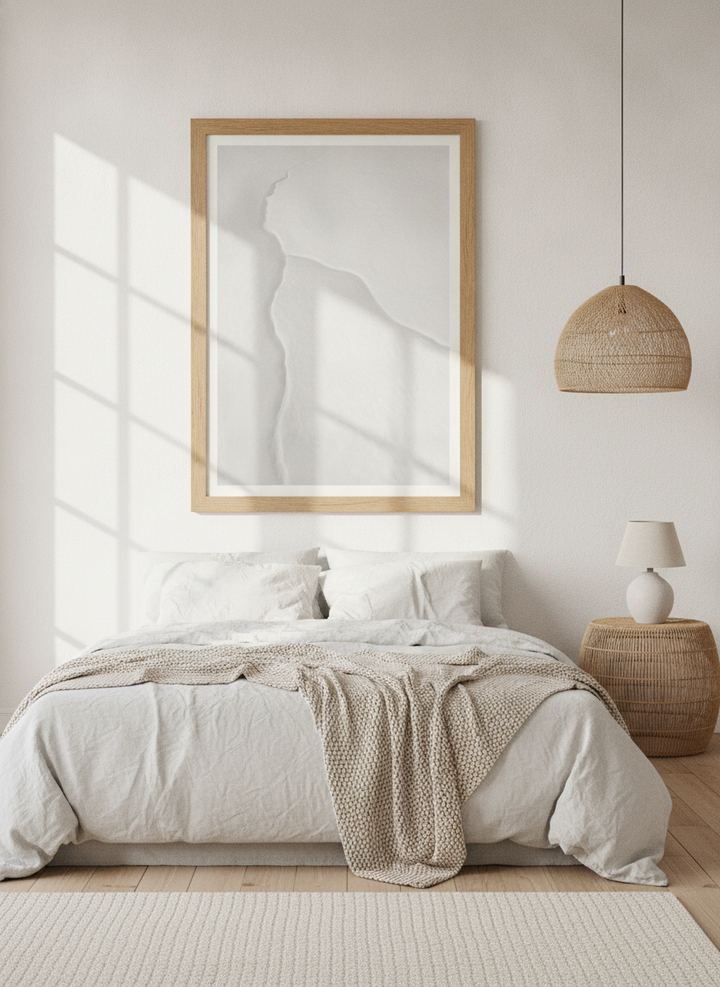 Modern wall art print styled on the wall in a bright Scandinavian bedroom