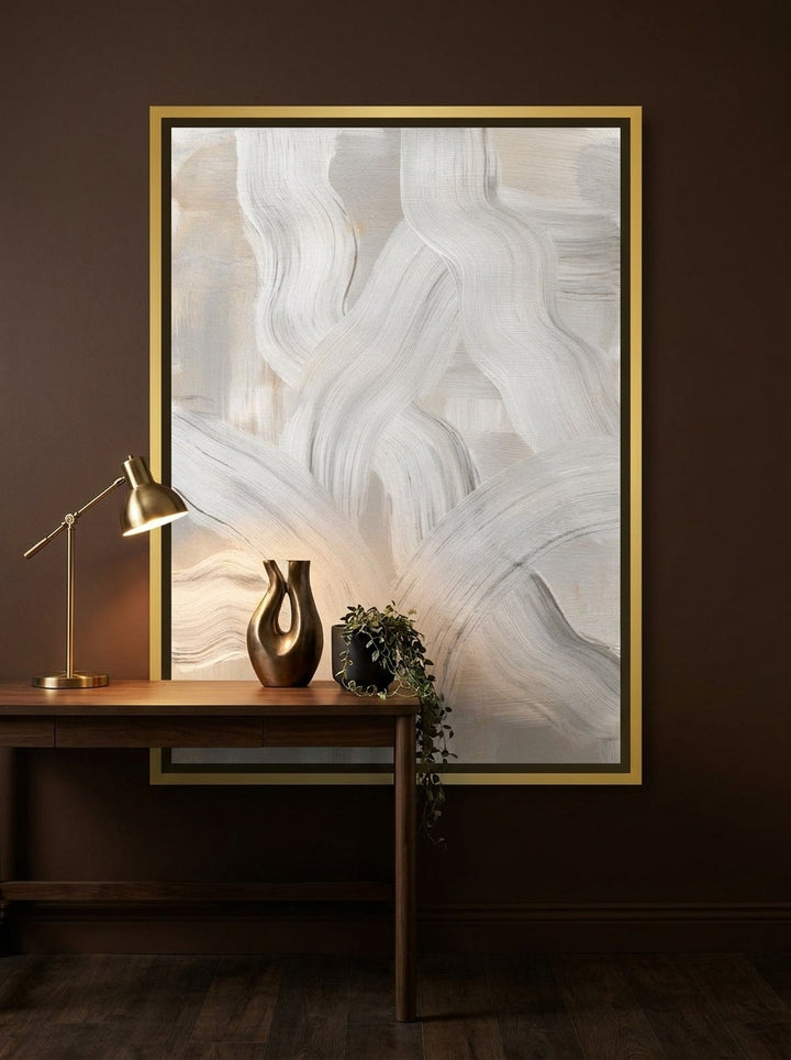 Canvas wall art with a gold leaf surround styled on the wall in a moody home office