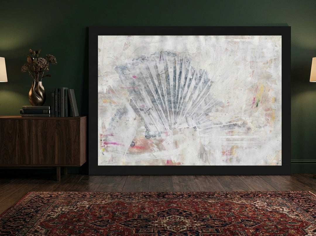 Modern wall art print standing on a sideboard in a moody living room