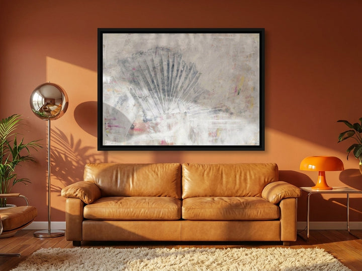 Canvas wall art with a black surround styled on the wall in a retro 70s living room