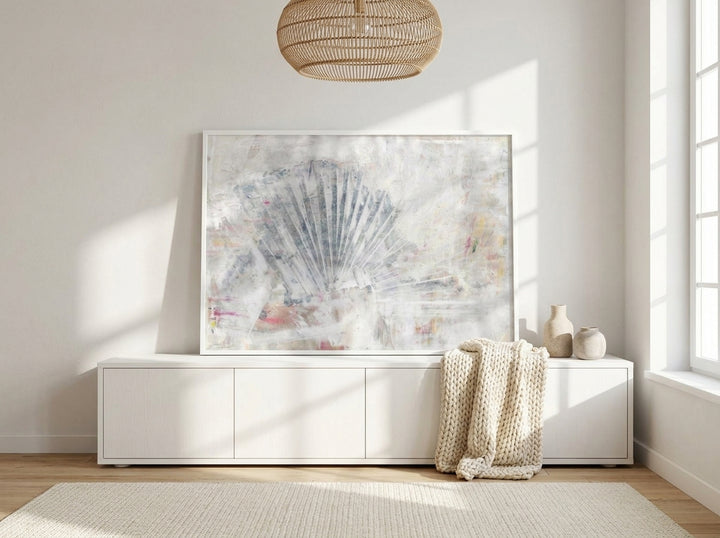 Modern wall art print standing on a sideboard in a bright Scandinavian home office