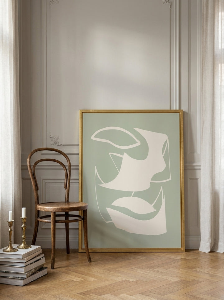 Canvas wall art with a gold leaf surround leaning against the wall in a Parisian bedroom