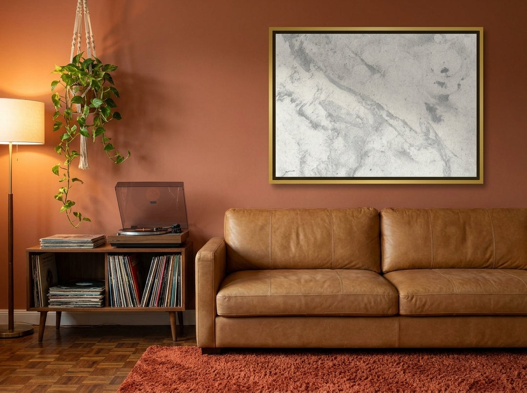 Canvas wall art with a gold leaf surround styled on the wall in a retro 70s living room