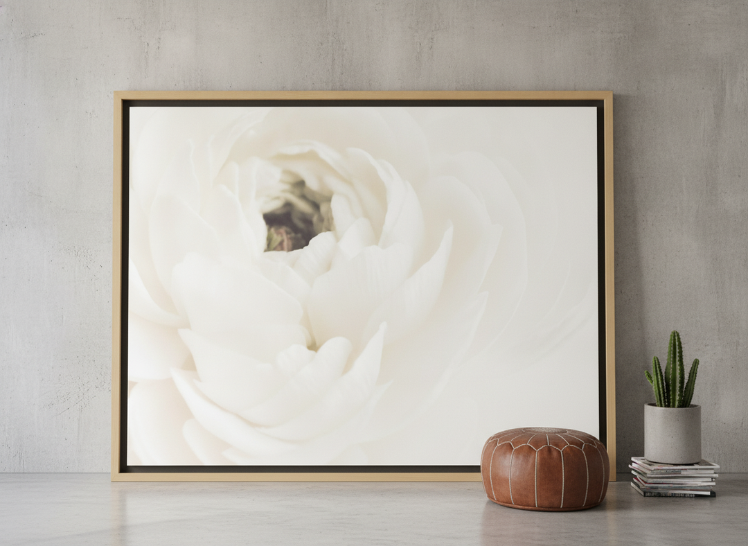 Oversized statement canvas wall art with a natural timber surround leaning against the wall in an industrial loft living room