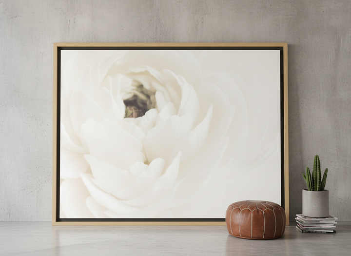 Oversized statement canvas wall art with a natural timber surround leaning against the wall in an industrial loft living room
