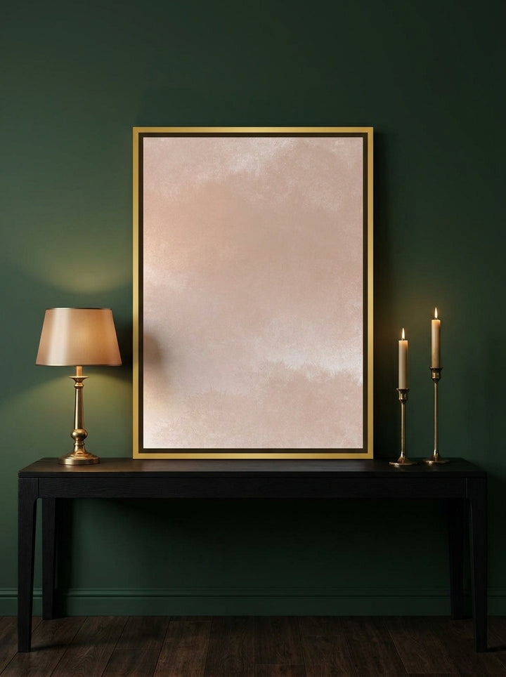 Canvas wall art with a gold leaf surround standing on a console in a moody bedroom