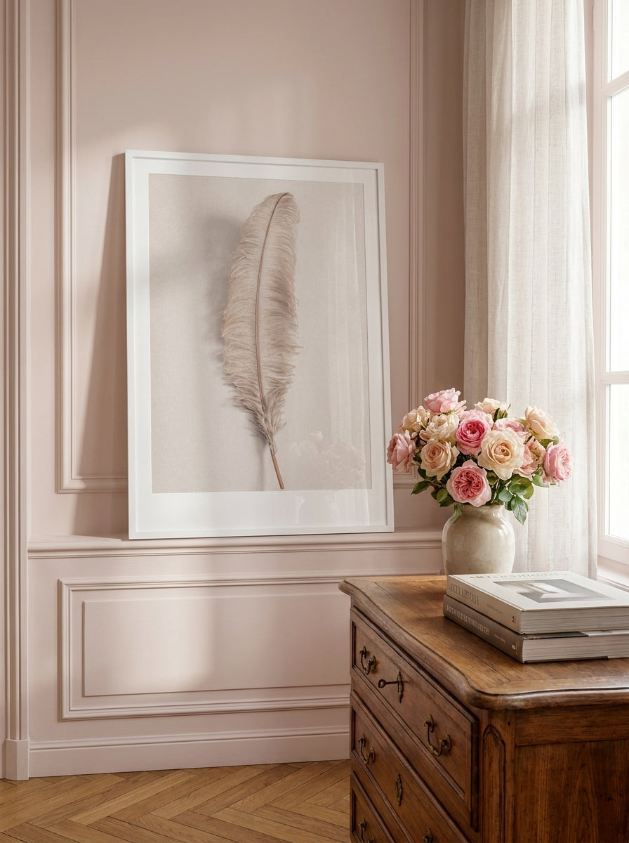 Modern wall art print standing on a sideboard in a Parisian bedroom