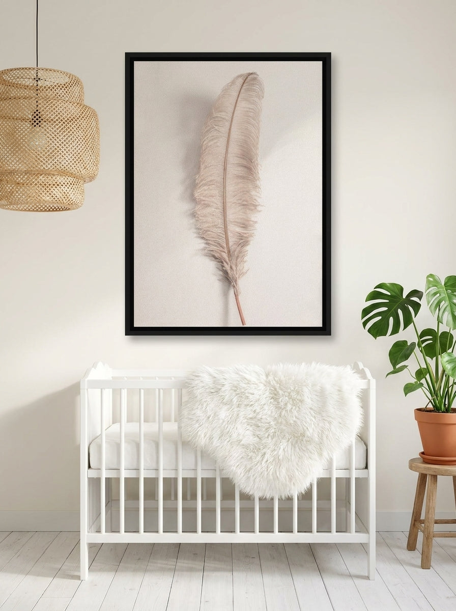 Canvas wall art with a black surround styled on the wall in a bright Scandinavian nursery