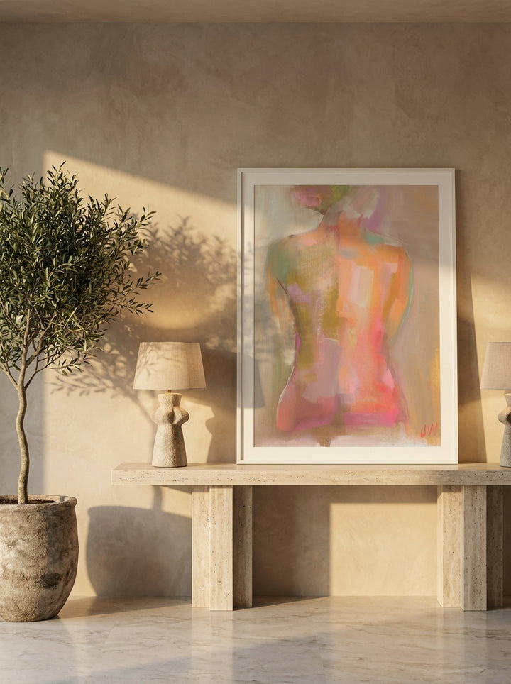 Modern wall art print standing on a console in a luxe dining room