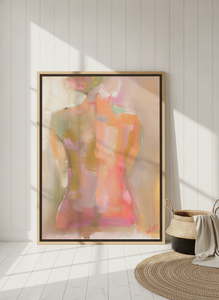 Oversized statement canvas wall art with a natural timber surround leaning against the wall in a coastal home office