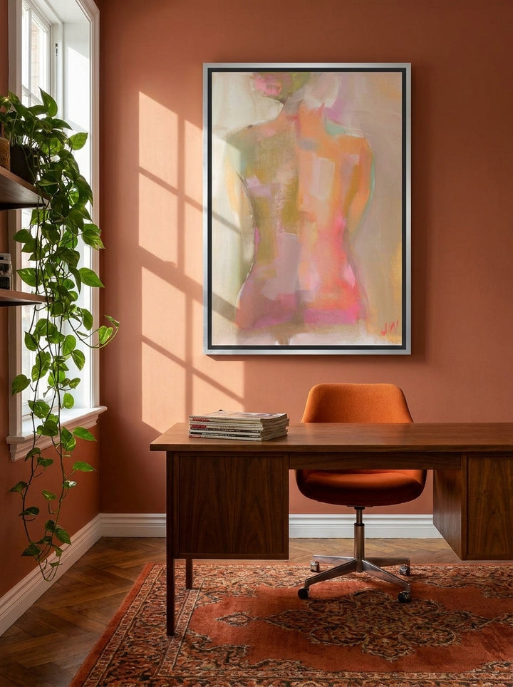 Canvas wall art with a silver leaf surround styled on the wall in a retro 70s home office