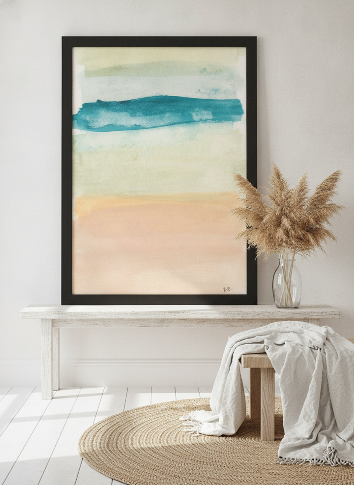 Modern wall art print standing on a console in a coastal bedroom