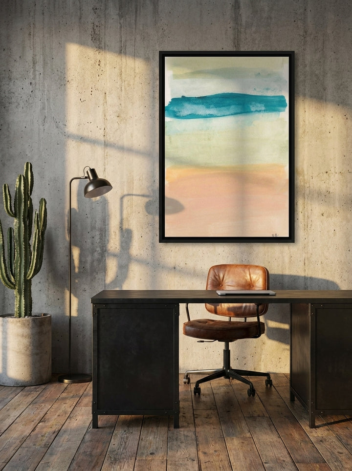 Canvas wall art with a black surround styled on the wall in an industrial loft home office